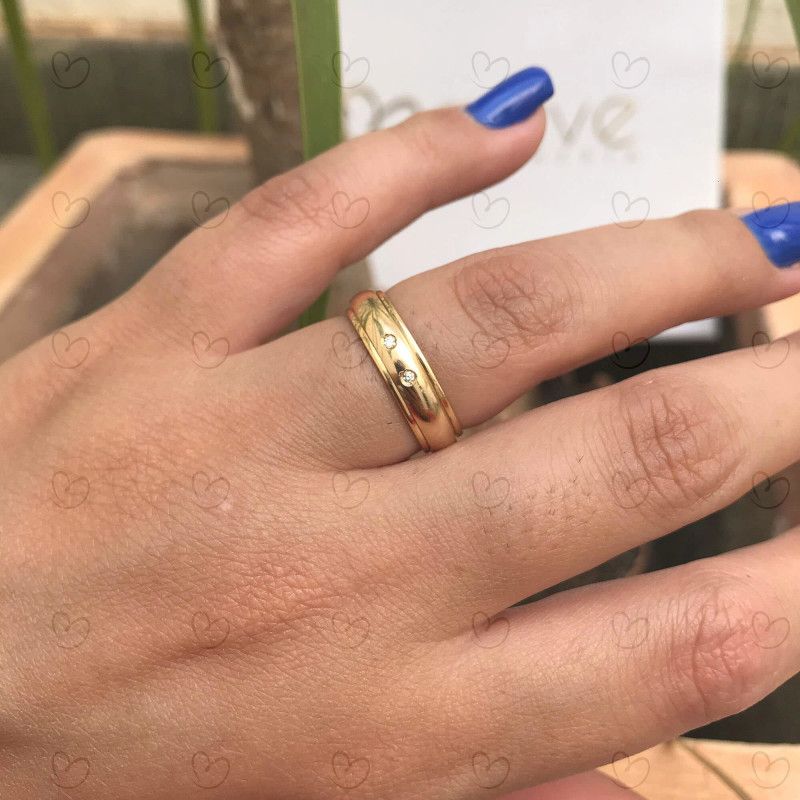 Aliança Giratória com Duas Pedras de Zircônia Ouro 18k